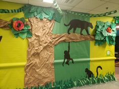 a bulletin board with animals and trees on it