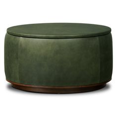 a green leather ottoman sitting on top of a wooden base