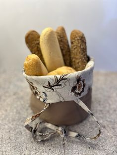 there are some breads in a cup on the table