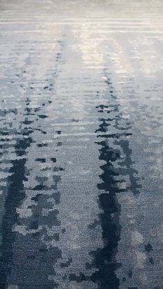 an area rug is shown with black and white designs