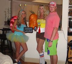 three people dressed up in costumes standing next to each other