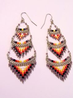 These gorgeous earrings were hand beaded in Peru. They measure 3 inches in length, 1 inch in width, with surgical steel ear wires. Traditional Multicolor Beaded Earrings Nickel Free, Traditional Teardrop Chandelier Earrings With Dangling Beads, Festival Jewelry With Round Beads And Ear Wire, Festival Chandelier Drop Earrings With Dangling Beads, Traditional Long Drop Jewelry With Dangling Beads, Traditional Long Drop Beaded Earrings With Dangling Beads, Festival Dangle Beaded Earrings For Pierced Ears, Festival Beaded Dangle Chandelier Earrings, Festival Beaded Dangle Earrings