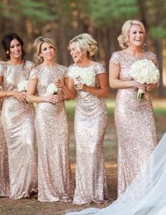 the bride and her bridesmaids are all dressed in gold sequin gowns