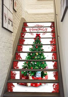 the christmas tree is on the stairs painted with red, white and green paint scheme