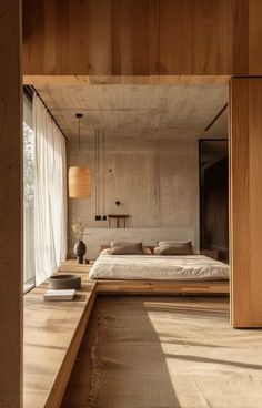 an open bedroom with wooden walls and flooring