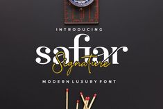 the font and numbers for safari signature is displayed on a black background with matchesticks