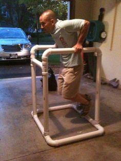 a man standing on top of a white hand rail