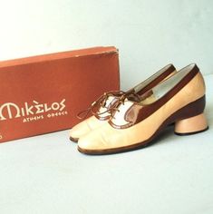 "Wearable art vintage 70s, cream- brown patent leather oxford style , sculptured , rounded heel, high fashion, hand made shoes by Mikelos, Athens collection. With the original box. Showstopping. Gently used condition. Clean and strong inside and out. No discoloration ,no odor. The shoes ( please see the photo) have a stiff leather on the back , look like a crinkle.But it's not noticeable. The glossy brown leather and leather shoelace in the excellent condition. Size 7AA. Length of the insole:9,5 Retro Brown Leather Oxfords, Retro Leather Oxfords With Pointed Toe, Retro Brogue Detailing Closed Toe Oxfords, Retro Brogue Oxfords With Closed Toe, Retro Oxfords With Brogue Detailing, Vintage Oxfords With Leather Sole And Pointed Toe, Vintage Oxfords With Leather Sole, Retro Brown Almond Toe Oxfords, Vintage Leather Oxfords With Almond Toe