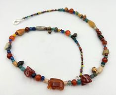 The Beautiful Glass, Carnelian Agate, Shell Etc. Beads Necklace Along With Small Carnelian Agate Elephant Figure As Bead Pendant With 2 Beautiful Red Carnelian Agate Engraved Beads Probably From Ancient South East Asian Cultures Regions. Size Details Pictures Are Listed Above. Good Conditions As Shown In The Pictures. We Provide Fast And Free Shipping Service World Wide To Our Customers .We Ship Mostly Via Fedex And DHL. If You Have Any Questions Please Feel Free To Send Us Message. Multicolor Carnelian Beaded Necklaces For Healing, Multicolor Carnelian Beaded Necklaces With Large Beads, Multicolor Carnelian Necklaces With Natural Stones, Multicolor Carnelian Beaded Necklace For Healing, Multicolor Carnelian Beaded Necklace With Large Beads, Multicolor Carnelian Necklaces With Polished Beads, Traditional Agate Necklace With Oval Beads, Amulet Style Carnelian Gemstone Beaded Necklace, Traditional Multicolor Carnelian Necklaces