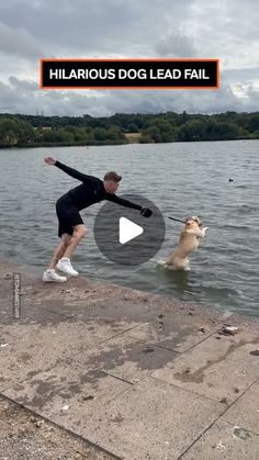 the man is playing with his dog in the water