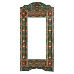 an ornate mirror is shown against a white background and it's frame has colorful designs on it