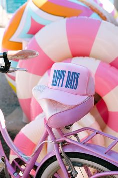 'Happy Days'! Printed on a light pink foam trucker hat in royal text. Perfect for sunny days by the shore, it's your go-to for chill vibes and fun times under the sun. I do not accept returns or exchanges! I am not responsible for missing/stolen packages please contact your local post office. If your item comes damaged please message me!  If you need to rush your order please message me to make sure I am able to fulfill the order in the desired timeframe. You are responsible to update your shipping method in the checkout.  For wholesale inquires please message me! Pink Snapback Hat With Curved Brim For Summer, Pink Curved Brim Snapback Hat For Summer, Pink Snapback Hat For Summer, Pink Trucker Hat For Spring Vacation, Pink Snapback Hat For Summer Outdoor Activities, Pink Snapback Hat For Summer Outdoor Events, Pink Snapback Hat For Summer Outdoor, Pink Trucker Snapback Hat For Summer, Pink Snapback Hat For Spring Outdoor