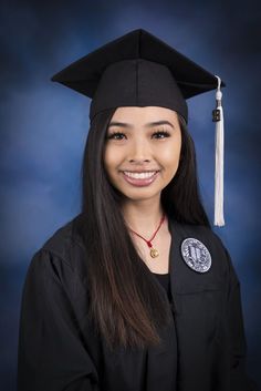 a woman wearing a graduation cap and gown