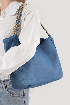 This Denim Fashion Tote Bag is the perfect accessory for any outfit! Made with durable denim material, it offers both style and functionality. Its spacious design allows you to carry all your essentials while still looking fashionable. Upgrade your wardrobe with this must-have bag. Width - 12.5"Depth - 4"Height - 10"Composition - Denim & Mix MetalsLead & Nickel Compliant Casual Denim Blue Shoulder Bag For On-the-go, Everyday Denim Blue Bag With Zipper, Everyday Denim Blue Bag With Zipper Closure, Denim Blue Bags For Everyday Use, Denim Blue Bags With Zipper Closure For Everyday Use, Denim Blue Cotton Shoulder Bag With Zipper Closure, Large Capacity Denim Blue Shoulder Bag, Rectangular Denim Hobo Bag For Daily Use, Everyday Large Capacity Denim Blue Shoulder Bag