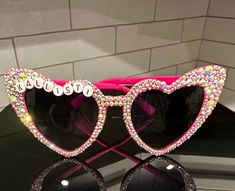 Make a statement with these sparkly sunglasses!Great for any occasion, Bride to be, Bridesmaids, Birthday Party, Party Favors, Kids Party Favor. **Made to order. Takes 2 to 3 weeks.    Message me for 3+ sunglasses for a discounted price and custom colors and themes. Glamorous Pink Sunglasses For Party, Party Crystal Sunglasses With Rhinestones, Glamorous Pink Party Sunglasses, Sparkly Sunglasses, Personalized Pink Sunglasses For Party, Customizable Fun Sunglasses For Parties, Fun Customizable Sunglasses For Party, Trendy Personalized Party Sunglasses, Fun Personalized Sunglasses For Party