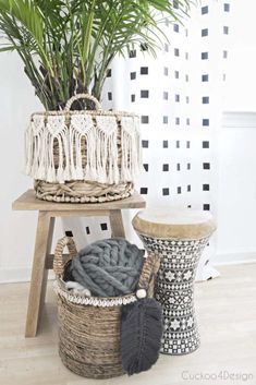 two baskets are stacked on top of each other and one has a plant in it