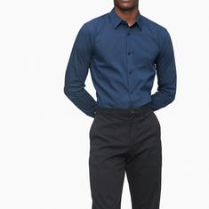 Calvin Klein Delf Blue Dress Shirt Slim Fit . Stretch Cotton Button-Down Shirt Versatile Solid Styling In A Diverse Array Of Seasonal Colors Provides Ultimate Comfort By Stretching As You Move Extra Soft Cotton Stretch Blend For A Smooth, Flexible Feel Point Collar And Button-Front Long Sleeves And Button Barrel Cuffs Embroidered Ck Logo And Shirttail Hem Machine Wash 76% Cotton 21% Polyamide 3% Elastane Size 16_16.5 Large Size Calvin Klein Button-up Business Casual Tops, Calvin Klein Button-up Tops For Business Casual, Calvin Klein Long Sleeve Shirt With Button Closure, Calvin Klein Work Shirt With Button Closure, Calvin Klein Casual Shirt With Spread Collar, Calvin Klein Cotton Shirt For Business Casual, Casual Calvin Klein Shirt With Spread Collar, Calvin Klein Collared Shirt For Work, Blue Slim Fit Shirt For Office