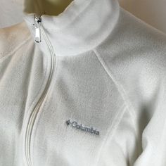 Beautiful White Columbia Jacket Size Medium Can Fit A Large! Beautiful Never Worn! Has The Columbia Label On The Front Left Breast And Has Two Zipper Pockets In The Front This Is A Mock Neck Zips From Top To Bottom! White Fitted Outerwear For Outdoor Activities, White Long Sleeve Sporty Fleece Jacket, Sporty White Long Sleeve Fleece Jacket, White Fleece Outerwear With Fleece Lining, Cozy White Fleece Jacket For Fall, White Fleece Jacket For Winter, White Fleece Jacket For Winter Outdoor, White Sporty Fleece Jacket For Cold Weather, Casual White Fleece Jacket For Outdoor Activities