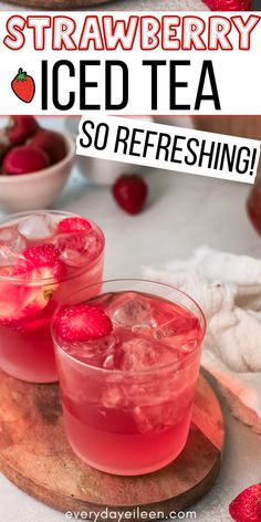 two glasses filled with ice tea on top of a cutting board next to strawberries