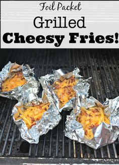 grilled cheesy fries on the grill with text overlay that reads foil packet grilled cheese fries