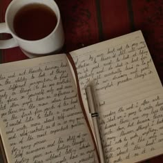 an open notebook with writing on it next to a cup of coffee