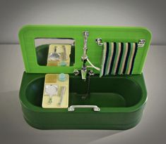 a green box with some items in it