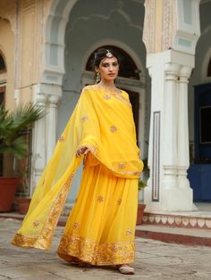 Afroz ; means illuminated and rightly the vibrant colors of this sharara set will light up your whole look for the festival. Made in breezy georgette, the set is embedded with taari and gotta work which is finished with love. Color: Yellow Fabric: Georgette Note: Length and sizes can be customised Length - Kurta 26 inches Pants 44 inches Available in other colors If you happen to see some deformity in hand-work or fabric, that’s mere the technique of the same and not a defect. The garment is qui Yellow Sharara Suits, Gulabo Jaipur, Yellow Sharara, Georgette Sharara, Sharara Pants, Kurta Sharara Set, Kurta Sharara, Gota Work, Sharara Suit