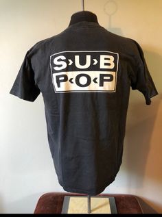 Vintage Sub Pop Tshirt  - 90's vintage  - Rare Loser Spell Out Shirt - Double sided graphic  - Sub Pop logo back graphic  - Single stitch sleeves  - Oneita tagged  - Rare Black colour way  Size: L  21"x27" Great vintage condition No rips or holes  No stains Band Merch Tops With Logo Print, Urban Screen Print Fan Merchandise Top, Retro Graphic Design Tops For Streetwear, Retro Graphic Tops For Streetwear, Urban Screen Print Top For Concert, Retro Concert T-shirt With Logo Print, Retro Logo Print T-shirt For Concert, Vintage Logo Print Top For Concert, Pre-shrunk Band Merch Tops For Streetwear