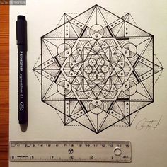 a pen drawing on paper with a ruler next to it and a pencil in the foreground