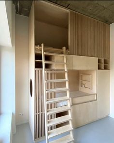 a bunk bed with stairs to the top and bottom is made out of plywood