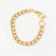 The Fine Grumet Chain Bracelet is a classic and elegant piece that adds a refined touch to your look. Crafted with a fine grumet link chain, this bracelet is gold plated to provide a luxurious shine. The minimalist design of the fine chain makes this bracelet versatile, perfect for daily wear or to complement more formal outfits. Its 16 cm size ensures a comfortable fit on the wrist, making it a timeless and sophisticated choice. The gold plating adds warmth and elegance to the Fine Grumet Chain Bracelet, enhancing the beauty of the grumet links. It’s ideal for those seeking a classic and understated piece of jewelry that adapts effortlessly to various styles and occasions. Wear the Fine Grumet Chain Bracelet alone for a delicate look or layer it with other bracelets to create a more elabo Minimalist Gold Cuban Link Bracelet For Everyday, Minimalist Gold Cuban Link Bracelet Tarnish Resistant, Gold-tone Curb Chain Bracelets Gold-plated, Gold-tone Curb Chain Bracelets Gold Plated, Gold-tone Curb Chain Bracelet Gold-plated, Gold-tone Curb Chain Bracelet, Gold Plated, Elegant Metal Charm Bracelet With Curb Chain, Classic Gold Plated Chunky Chain Bracelet, Classic Gold Bracelets With Chunky Chain