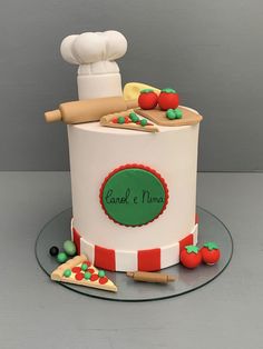 a cake that is decorated to look like a chef's hat and some food