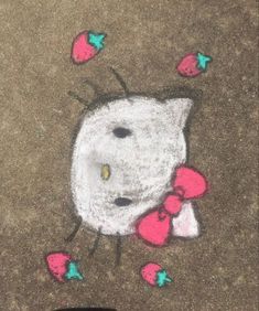 chalk drawing of hello kitty on the ground