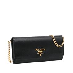 This Prada wallet on chain is made of black textured Vitello Move leather. The Bag features gold-tone details, a gold-tone chain strap, a flap with snap closure, and a zippered compartment and slip pockets for cards inside. The Bag is best across the body or loosely over the shoulder. Prada Wallet On Chain, Wallet On Chain, Miuccia Prada, Prada Wallet, Diaper Backpack, Casual Backpack, Fashion Labels, Leather Goods, Prada Bag