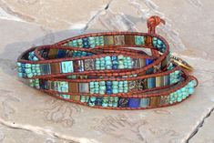 Leather Wrap Bracelet 4 Row Wrap Denim Dragonfly Quad Wrap Bracelet Mother of Pearl Boho Bracelet Bohemian Jewelry by Aerieanna's Wristcraft - Etsy Blue Spiritual Wrap Bracelet For Festival, Handmade Blue Wrap Bracelet, Handmade Artisan Blue Wrap Bracelet, Blue Hand Wrapped Wrap Bracelet For Festivals, Blue Bohemian Wrap Bracelet For Festivals, Artisan Handmade Blue Wrap Bracelet, Blue Bohemian Handmade Wrap Bracelet, Adjustable Blue Wrap Bracelet, Artisan Blue Adjustable Wrap Bracelet