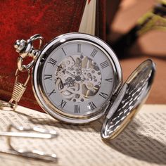 DESCRIPTION: This Silver Full Hunter Pocket Watch is a classic design for anyone to appreciate. The cover is intricately designed with a subtle interlocking pattern and room for engraving personal initials, making it the perfect gift for any occasion. The crystal face and back cover brilliantly showcases the skeleton and mechanics of the clock's inner workings, giving it an antique feel that any pocket watch lover would enjoy. A Full Hunter Pocket Watch is a classic style that includes a pocket Steampunk Hand, Interlocking Pattern, Florence Scovel, Mechanical Pocket Watch, Amazon India, Skeleton Watches, Fob Watch, Patek Philippe Aquanaut, Watch Lover