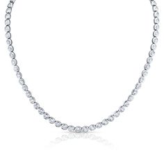 This breathtaking Oval Cut Diamond Necklace features a total of 74 stones, totalling 14.47 carats, and boasting an approximate G-H color and VS clarity. Dazzling Platinum Oval Necklaces, Formal Oval Tennis Necklace With Brilliant Cut, Formal Oval Brilliant Cut Tennis Necklace, Classic Oval Diamond Tennis Necklace, Silver Oval Diamond Tennis Necklace, Platinum Tennis Necklace, Elegant Bezel Set Tennis Necklace, Elegant Round Bezel Setting Tennis Necklace, Oval Diamond Tennis Necklace