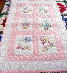 a quilted table topper with many different designs on it's edges and sides