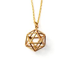 "Tiny brass intricate merkaba pendant. The Merkaba is the divine light vehicle. \"Mer\" means Light, \"Ka\" means Spirit, \"Ba\" means Body.Mer-Ka-Ba means the spirit and the body surrounded by counter-rotating fields of light, spirals of energy as in DNA, which transports the spirit and body of the person who wears it from one dimension to another. Comes with 16 inch bronze chain. Material: Bronze wire Dimensions: 15mm by 21mm by 15mm All of our jewellery packed in our labeled gift box Let us k Dna Spiral, Sacred Geometry Jewelry, Higher Dimensions, Fake Gauge Earrings, Bali Earrings, Divine Light, Packing Jewelry, Gauged Earrings, Handmade Wire