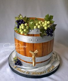 a cake made to look like a barrel with grapes in it