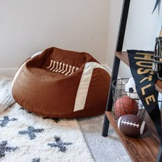 a football themed dog bed on the floor