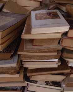 a pile of books sitting on top of each other