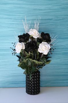 Beauty that lasts! "Black & White Roses" Sparkling silk floral design with a modern to contemporary twist of classic colors with white crystal sprays and black gems and feathers for added glamour! Features white roses and black rose's nestled in a black glossy bubbles ceramic vase. Fancy up your home décor living room coffee table or dinning table for that finishing touch. Perfect centerpiece for black and white weddings and can be used for bachelor or bachelorette party! This arrangement is 27" inches tall x 16" inches at widest. White Wedding Table Centerpieces, Black And White Centerpieces, Ceramic Centerpiece, Floral Black And White, Black And White Roses, White Centerpiece, Modern Floral Design, Roses Black, Silk Floral Arrangements