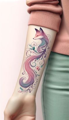 a woman's arm with a colorful tattoo design on the left side of her arm