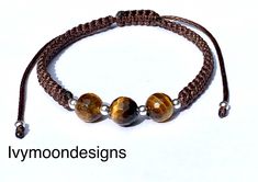 Handmade beaded bracelet made with natural tiger eye beads and real sterling silver beads      -brown waxed cotton thread-1.2mm     -natural tiger eye beads-8mm     - real sterling silver beads-3mm Waterproof bracelet, unisex, adjustable  Tigers-Eye has strong grounding energy that will make sure your physical body is connected to the earth. This stone will infuse you with confidence so that you can fulfill any role, perform any task, and speak to anyone with wisdom and grace. This will ensure t Adjustable Brown Beaded Bracelet With Gemstone Beads, Adjustable Brown Gemstone Beaded Bracelets, Brown Braided Bracelets With 8mm Beads, Handmade Sterling Silver Brown Bracelet, Adjustable Brown Jewelry With Silver Beads, Handmade Brown Sterling Silver Bracelets, Handmade Brown Beaded Bracelets For Everyday, Brown Bracelets With Silver Round Beads, Handmade Brown Spiritual Braided Bracelets