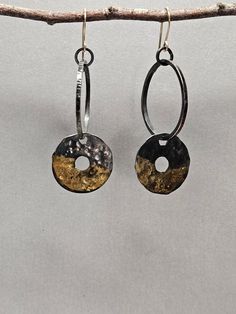 I usually incorporate stones in my work, but sometimes sterling silver accented with rich high karat gold is just right. I like the fact that bimetals go with everything and can work for an easy everyday earring. These earrings are a modified hoop. They are a circle hoop with a wider flat circle dangle. The larger circle is approximately 1 inch in diameter. Both circles are hammered with organic textures, lightly oxidized and then polished for a bright finish. The oxidation adds contrast to the texture and makes the gold pop. The flat circle dangle has been accented with gold utilizing the ancient Korean method of Kuem Boo.  They hang from custom-made gold filled ear wires and a soldered jump ring. The earrings hang approximately 2 1/2 inches from the top of the ear wire to the bottom of t Hooped Earrings, Keum Boo, Organic Textures, Everyday Earrings, A Circle, Silver Accents, Ear Wire, Ear Wires, Circles