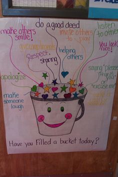 a bulletin board with words written on it and a bucket full of stars in the middle