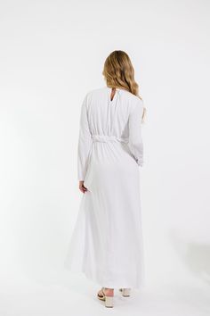 Experience formal elegance in the Brandy Dress. Crafted from a thick fabric and featuring long sleeves, a twist waist tie, a keyhole closure in the back, and subtle details such as hip pockets, this white LDS temple maxi dress is the perfect balance between simplicity and refined sophistication. 100 Polyester Model Measurements: Hips 34” Waist 25” Bust 32” Height 5’6.5, wearing a size small Measurements XS: Bust 32” + stretch | Waist 28” + stretch | Hips 36” | Length 53” S: Bust 34” + stretch | Brandy Dress, Lds Temple Dress, Bridesmaid Tops, Stretch Hips, Temple Dress, Temple Wedding, Lds Temple, Lds Temples, Nursing Friendly