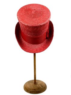 Straw Top hat in red. Made with 8/9 millimeters natural red straw braid and embellished with a 70 millimeters wide red grosgrain ribbon. Measurements in centimeters are 33 x 24. Crown height 13.5. Brim length 7. These measurements may have some slight variation depending on the size of the hat. For its elaboration we only use very good quality and resistant straw braids. In our workshop in the Pyrenees we sew and work one by one our hats with wooden molds of our own design. For other sizes, plea Red Top Hat With Curved Brim For Spring, Red Curved Brim Top Hat For Spring, Red Short Brim Top Hat For Spring, Fitted Red Brimmed Top Hat, Red Summer Boater Hat With Short Brim, Fitted Red Straw Hat For Summer, Red Short Brim Top Hat For Summer, Red Fitted Vintage Top Hat, Fitted Red Top Hat For Spring