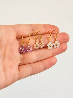 Crystal Daisy Dangle Earrings Inspired by dainty daisies, these cute dangle earrings are the perfect addition to your look. Ideal for those who love a floral design and drop style earrings. Makes for a lovely custom gift or a present for yourself! DETAILS Materials: Glass crystals, Gold color wire and beads If you have any questions send me a message so we can chat! 🥰 Dainty Hypoallergenic Flower Earrings, Flower Shaped Crystal Earrings With Flower Charm For Gifts, Flower Shaped Crystal Earrings With Flower Charm, Flower-shaped Crystal Earrings With Flower Charm As Gift, Flower-shaped Crystal Earrings With Flower Charm, Dainty Flower Earrings For Her, Dainty Hypoallergenic Dangle Crystal Earrings, Dainty Flower Earrings As Gift For Her, Dangle Flower Earrings With Ear Wire For Her